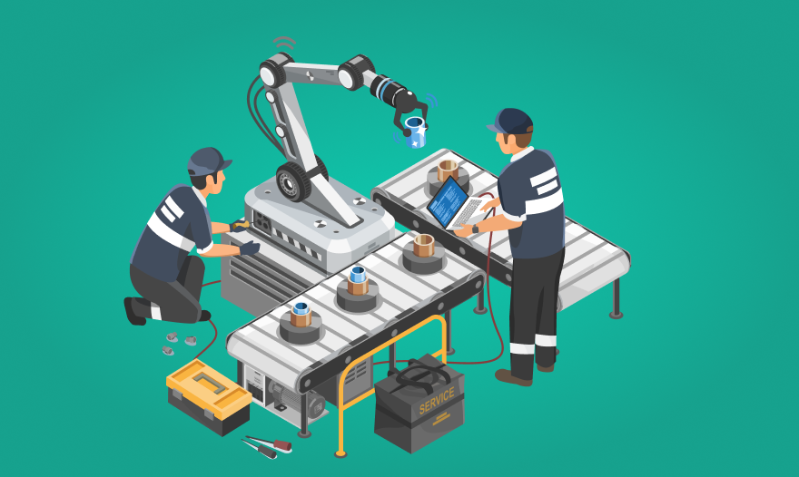 Two men collaborating on a machine in an industrial setting, surrounded by equipment and machinery.