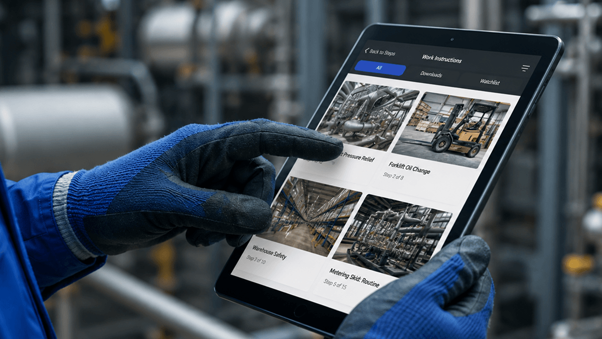 Worker using a tablet to view digital work instructions.