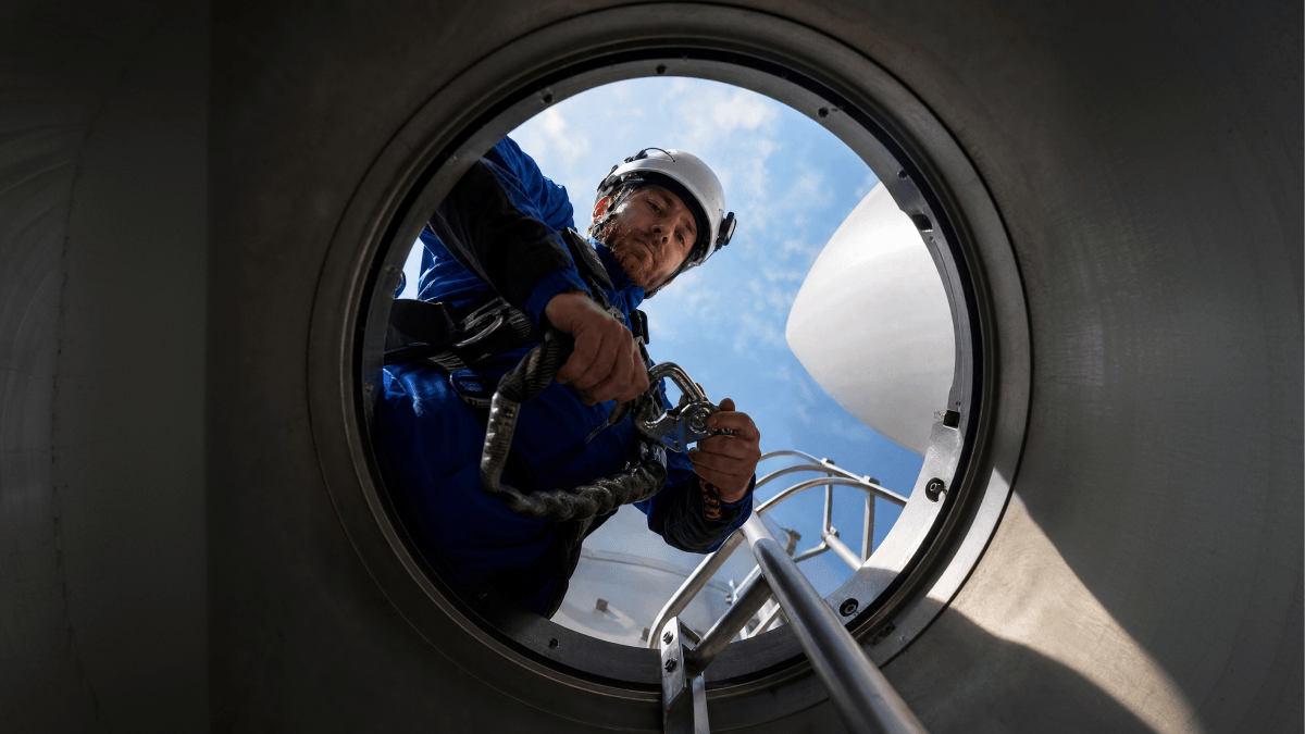 Photo of a man staring down at a device